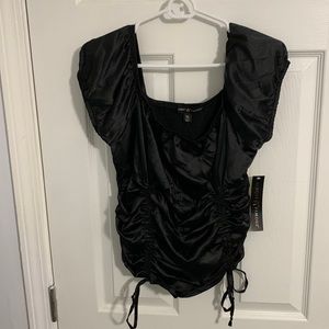 Black shirt by Almost Famous. Never worn, tag attached.